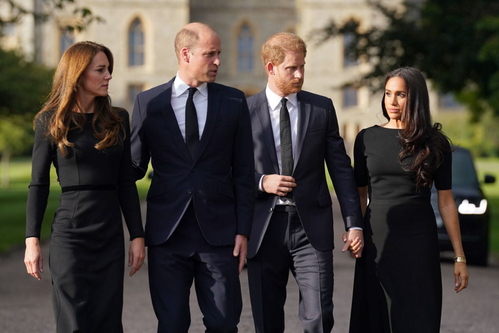 Catherine, Princess of Wales, Prince William, Prince of Wales, Prince Harry, Duke of Sussex, and Meghan, Duchess of Sussex on the long Walk at Windsor Castle on September 10, 2022 in Windsor, England. Crowds have gathered and tributes left at the gates of Windsor Castle to Queen Elizabeth II, who died at Balmoral Castle on 8 September, 2022.